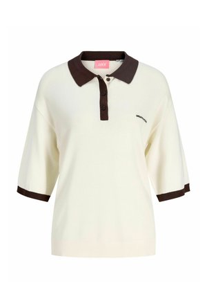 Kremfarget kortermet poloshirt med mørkebrunt krage, knappestolpe og ermekanter, med liten "CREATIVITY"-tekst på brystet.