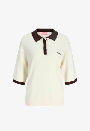 Kremfarget kortermet poloshirt med mørkebrunt krage, knappestolpe og ermekanter, med liten "CREATIVITY"-tekst på brystet.