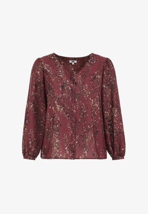 Bordová blúzka s výstrihom do V, dlhými nadýchanými rukávmi a prednými gombíkmi. Vyznačuje sa kombinovanou potlačou zlatých, čiernych a pieskových vzorov.