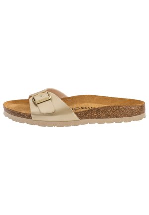 Sandalo slide beige realizzato in materiale morbido con una singola fibbia regolabile. La soletta in sughero e la suola in gomma leggera offrono comfort e aderenza.