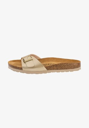 Beige slidesandal i blødt materiale med en enkelt justerbar spænde. Korkfodseng og let gummiydersål giver komfort og skridsikkerhed.