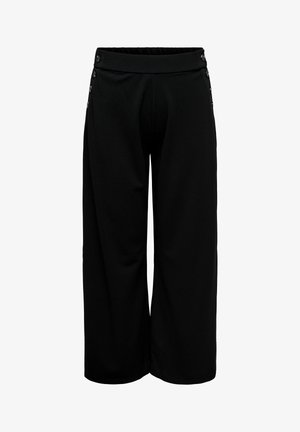 Melnas platu piegriezumu bikses ar augstu vidukli un dekoratīvām pogām gar sāniem pie jostasvietas.