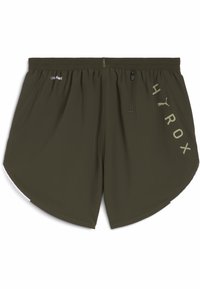 Oliivroheline sportlik lühike pükskostüüm, mis on valmistatud kergest kangast. Omab tõmblukuga taskut, kaarjat hemmi ja küljel trükitud logo.