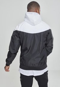 Urban Classics ARROW WINDRUNNER - Poletna jakna - red/blk