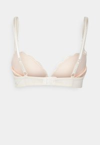 Leicht gepolstertes, cremefarbenes Bralette mit gewelltem Spitzensaum, verstellbaren Trägern und Haken- und Ösenverschluss hinten.