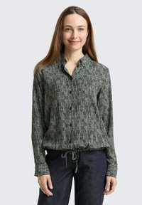 Schwarz-weiß gestreifte Button-up-Bluse mit Kragen, verstellbarem Zugbandsaum und langen Ärmeln. Weicher, leichter Stoff.