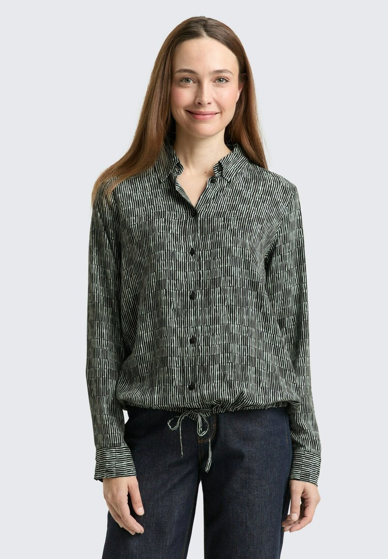 Schwarz-weiß gestreifte Button-up-Bluse mit Kragen, verstellbarem Zugbandsaum und langen Ärmeln. Weicher, leichter Stoff.