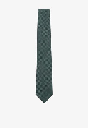 Dark green silk tie with small white polka dots, narrow shape, pointed tip, smooth texture, and a classic design suitable for formal wear.