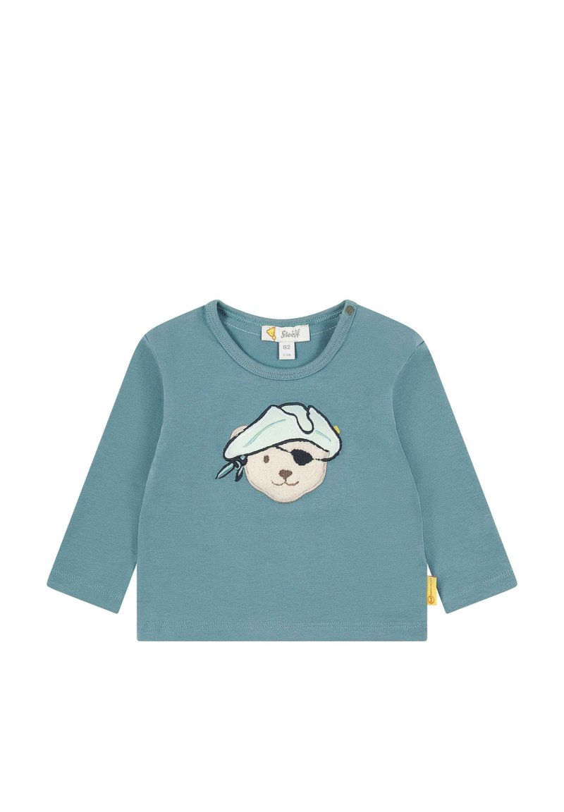 Katoenen shirt met lange mouwen in teal met een geborduurd berenface dat een hoofdband draagt. Voorzien van een drukknoopsluiting op de schouder.