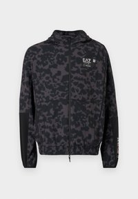 Hooded jacket in black with a grey abstract pattern. Features zip closure, elastic cuffs, and a branded logo on the chest.