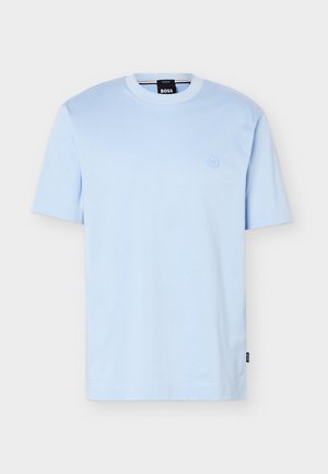 Light blue short-sleeve crew neck T-shirt with small embossed logo on chest and black "BOSS" label inside collar and side seam.