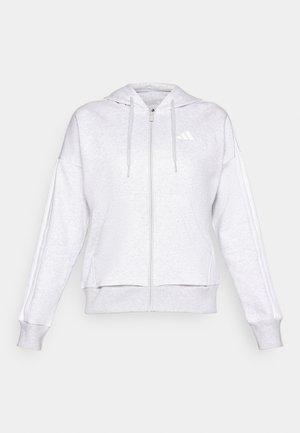 Gaiši pelēks džemperis ar rāvējslēdzēju priekšpusē, regulējamu auklu un divām sānu kabatām. Iekļauj baltu logo un svītras gar piedurknēm.