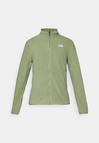 Veste en polaire vert clair avec fermetures éclair sur toute la longueur, col haut et deux poches latérales zippées. Présente un petit logo blanc sur la poitrine gauche.
