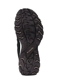 Schwarze Gummisohle mit strukturiertem Profil für Grip, mit Columbia-Logo und kontrastierenden Akzenten aus hellen Materialien.