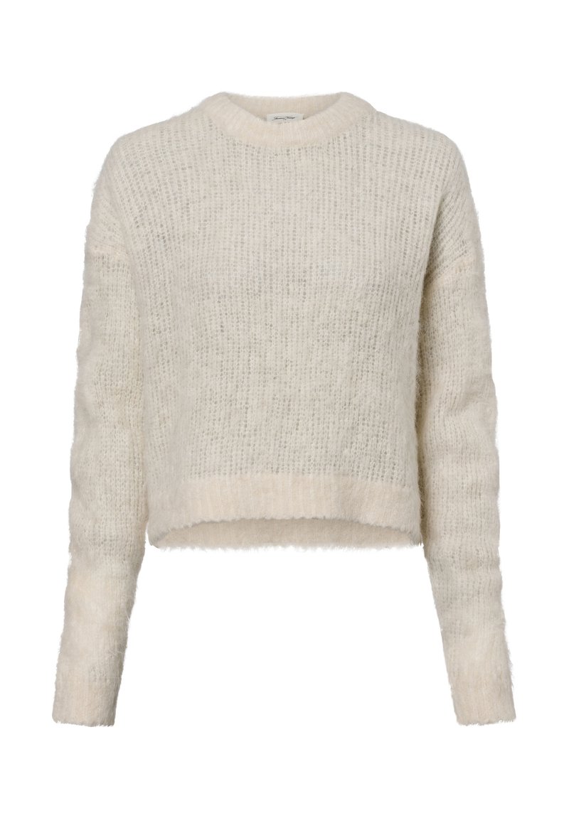 Lys beige avskåret genser laget av fuzzig strikket stoff. Har lange ermer og rund halslinning med en myk tekstur og ribbet kant.