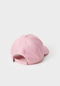 Pink baseball cap made of smooth fabric, featuring a curved brim, six panels with stitching, and an adjustable strap at the back.