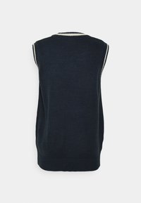 Bezrekawnikowy ciemnoniebieski dziany sweter z okrągłym dekoltem i kontrastową beżową lamówką na kołnierzu i otworach na ramiona. Gładka faktura.