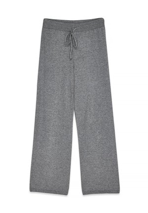 Pilkos megztos plačios kelnės su elastine juosmens juosta ir raištelių užsegimu, sukurtos kasdieniam nešioti.