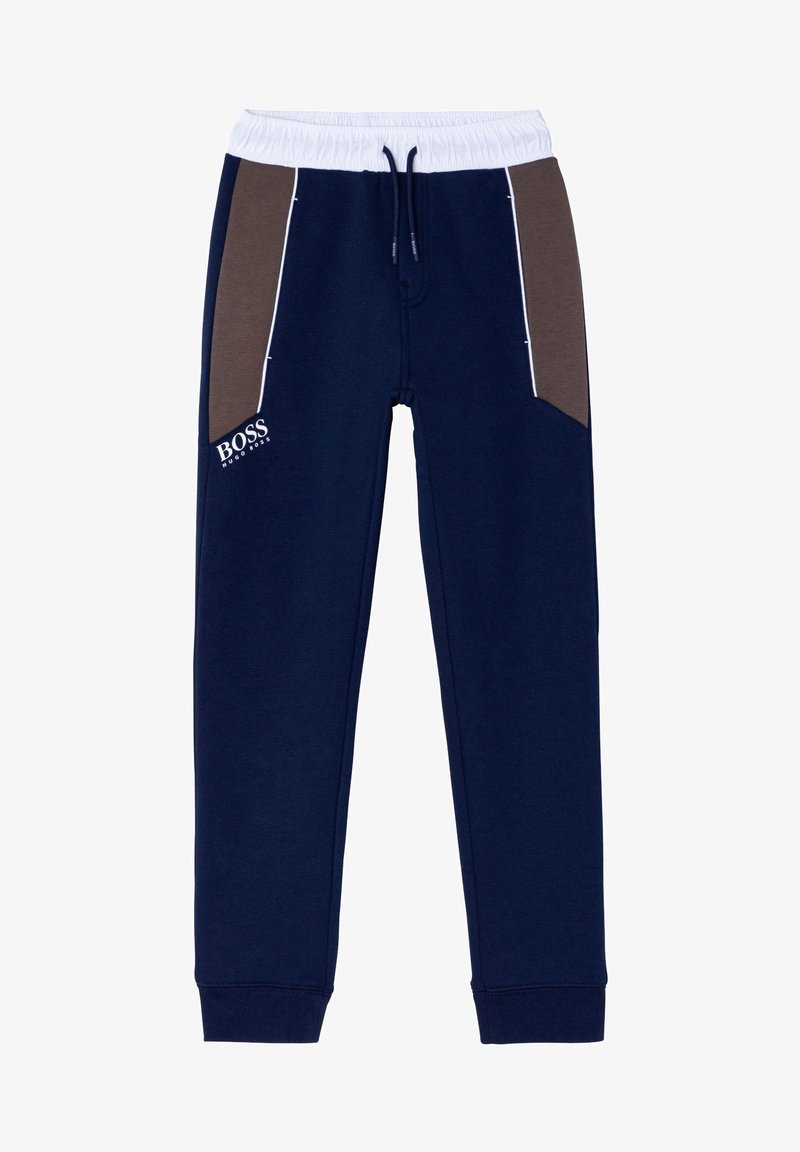 Marineblauwe joggingbroek met witte elastische tailleband, bruine zijpanelen, witte bies, trekkoord en het logo "BOSS Hugo Boss" op de linker broekzak.