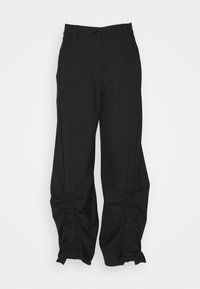 Black trousers with a ruched design at the cuffs. Made from a smooth, lightweight fabric; features a button closure and belt loops.