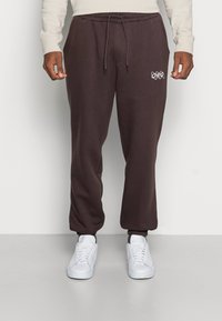 Jack & Jones JJIKANE ELLIOT  - Calças de fato de treino - seal brown