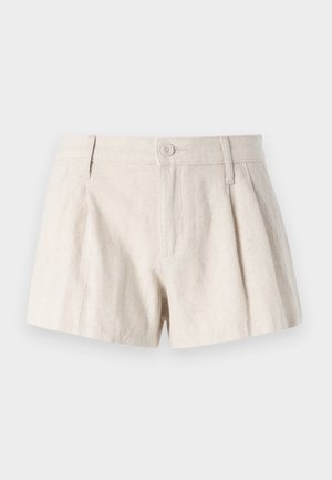 Linen shorts in a light beige color, featuring a pleated design, front button closure, and a smooth, textured finish.