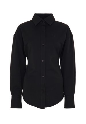 Schwarzes Langarmshirt aus weichem Stoff, mit Knopfverschluss vorne, spitzem Kragen und abgerundetem Saum. Enthält ein dezentes Logo auf der Brust.