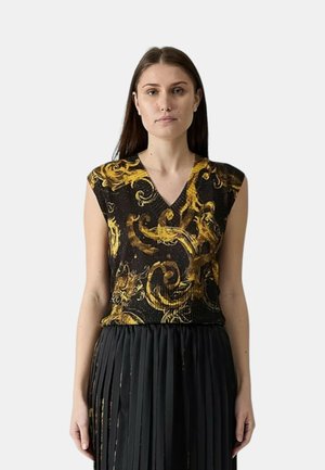 Zwarte mouwloze top met een gouden spiraalpatroon, V-hals ontwerp, gestructureerde stof, gecombineerd met een geplooide zwarte rok.