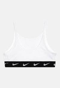 Valge spordirinnahoidja õhukeste rihmadega ja musta elastse vööga, millel on korduvad valged Nike logod. Sile kangas, sportlik disain.