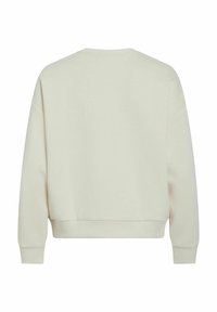 Sudadera beige clara, hecha de una suave mezcla de algodón, con un corte relajado, puños y dobladillo acanalados, y un sencillo cuello redondo sin adornos.