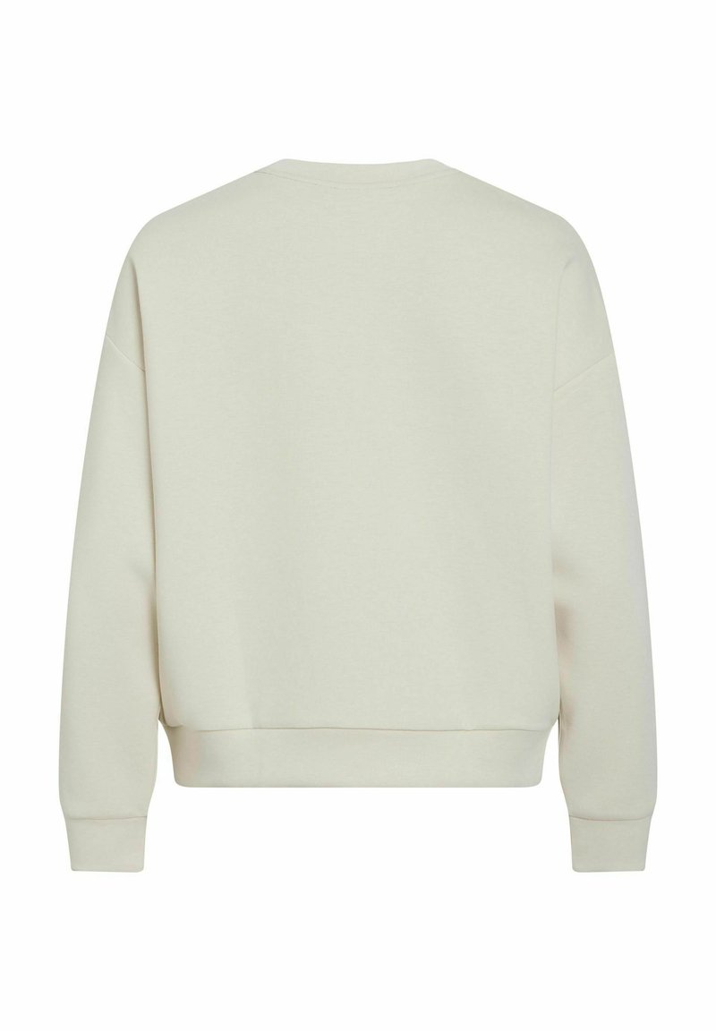 Helles beigefarbenes Sweatshirt aus weichem Baumwollmix, mit lockerer Passform, gerippten Bündchen und Saum sowie einem schlichten Rundhalsausschnitt ohne Verzierungen.