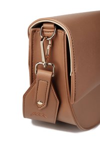 Brown leather handbag with a smooth texture, featuring gold-tone hardware, a detachable strap, and a distinctive logo detail on the strap.