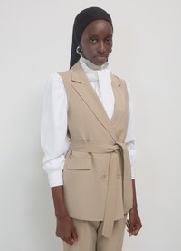 Calliope Smanicato - beige