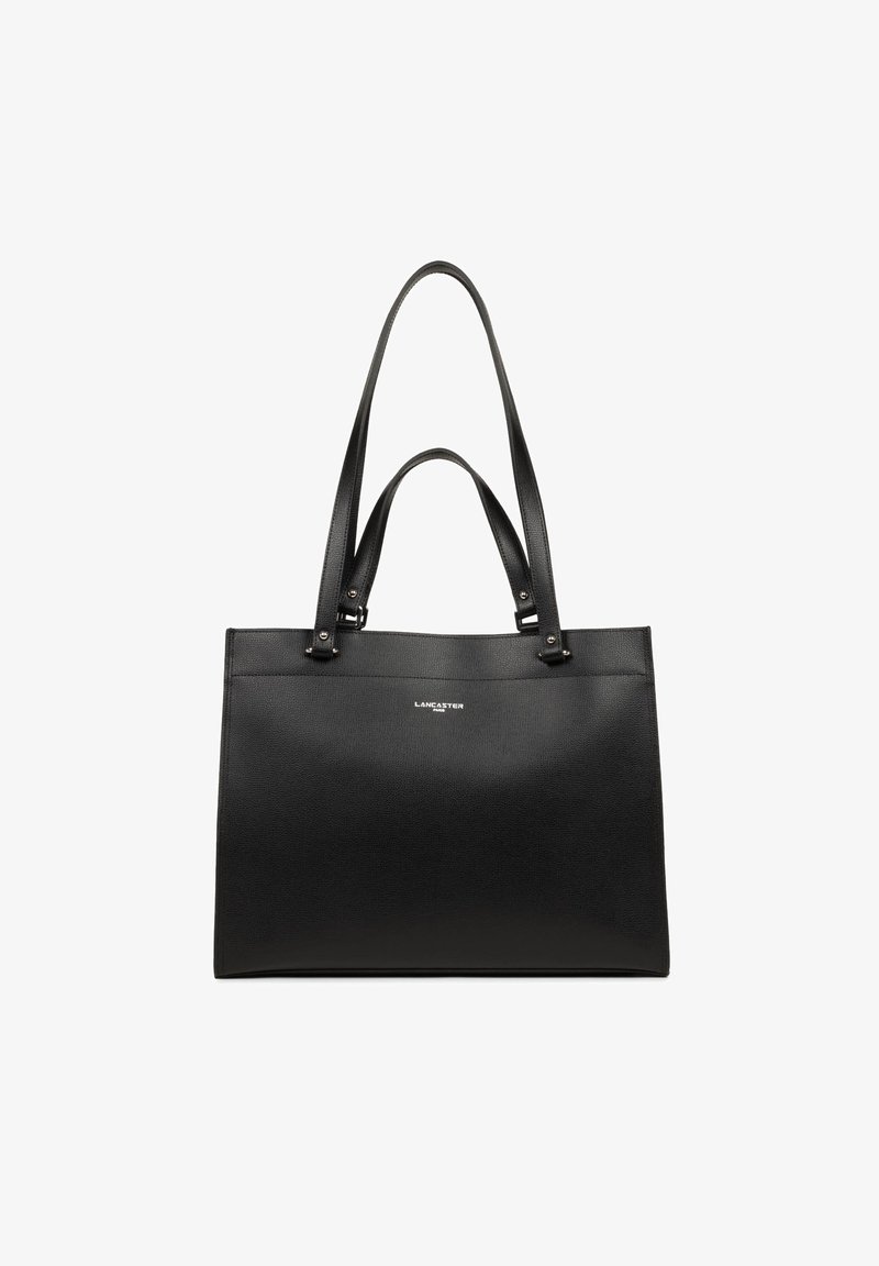 Sac fourre-tout en cuir noir avec texture lisse, deux longues poignées et design minimaliste. Présente un logo argenté sur le devant.