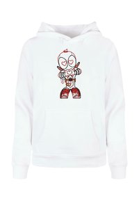 Fehér kapucnis pulóver, amelyen egy szív alakú szemű rajzfilmfigura szerepel, aki kamerát tart, piros nadrágot és csíkos ujjat visel.