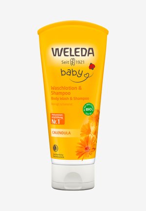Tubetto giallo di Weleda Baby Body Wash & Shampoo, con fiori di calendula e un'etichetta verde biologica. Plastica liscia e facilmente spremibile con tappo a flip.