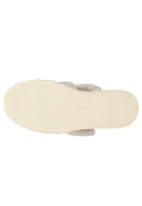 Chausson en peluche blanc à enfiler avec une semelle en caoutchouc texturé, présentant un motif en zigzag. Dessus en tissu doux avec une finition duveteuse.