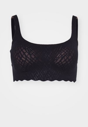 Mustaharjallinen musta pitsibralette, jossa on pehmeä, aaltoileva helma ja leveät hihnat. Tässä on koko vaatekerroksen läpi ulottuva tekstuuriltaan geometristen kuviot. Ei muotoilua tai toppausta.