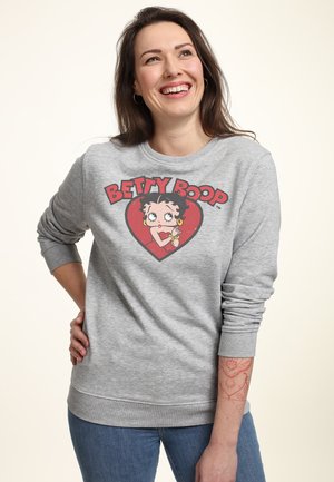 Jasnoszara bluza z grafiką Betty Boop w czerwonym sercu. Długie rękawy z prążkowanymi mankietami i okrągły dekolt.