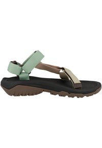Strappy sandal with a black rubber sole, beige, brown, and mint green straps. Features a textured footbed and rugged tread.