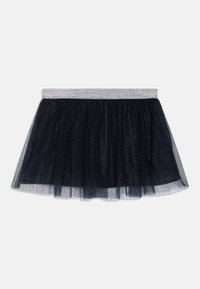 Svart tylskjørt med en glitrende sølv elastisk midje, med lagdelt design og små spredte detaljer for ekstra preg.