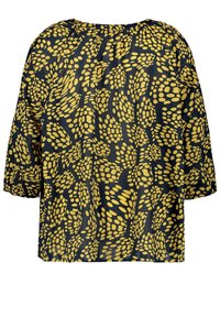 Czarna bluzka o luźnym kroju, z żółtym wzorem w kropki, okrągłym dekoltem i krótkimi rękawami, wykonana z lekkiego materiału.