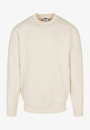 Kreemivärvi sweatshirt, millel on soonikkoe kaelus ja varrukad. Omab vabalt istuvat lõiget, pehmet tekstuuri ning ei sisalda nähtavaid mustreid ega graafikat.