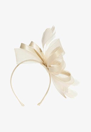 Beige satin headband with large mesh bow and delicate feathers arranged in an elegant decorative design.