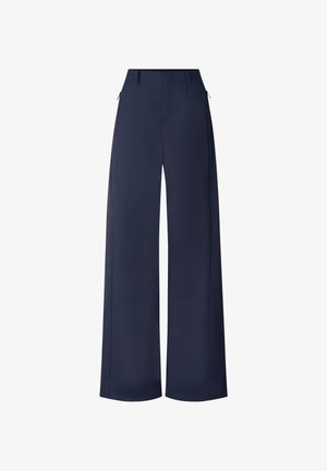 Granatowe spodnie o szerokich nogawkach z szlufkami na pasek, przednim zamkiem błyskawicznym i bocznymi kieszeniami, prezentowane na białym tle.