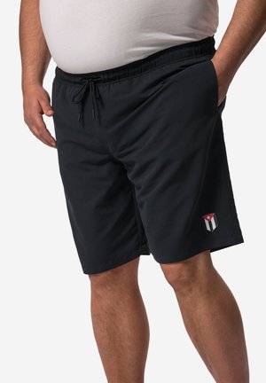 Sorte svøm Shorts med elastisk talje og snøre. Har et lille emblem på den nederste side. Glat tekstur, knæ-længde design.