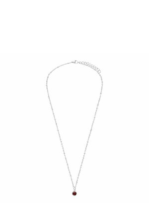 Silver chain necklace featuring a small round pendant with a red gemstone at the center, showcasing a polished finish and delicate links.