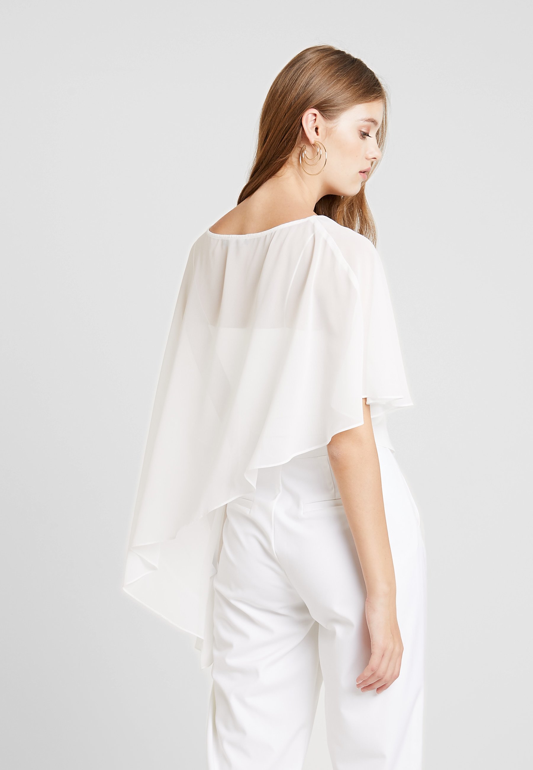 Swing Cape creme weiss Zalando.no Swing Cape - champagner