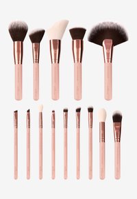 Set di 12 pennelli per trucco con setole morbide e ferrule in oro rosa. I manici sono di un rosa chiaro e presentano varie forme per diverse applicazioni.