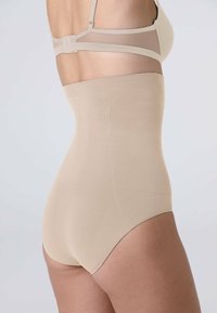 Slip modellante beige a vita alta realizzato in materiale elasticizzato, con texture liscia e design senza cuciture per un aspetto snello.